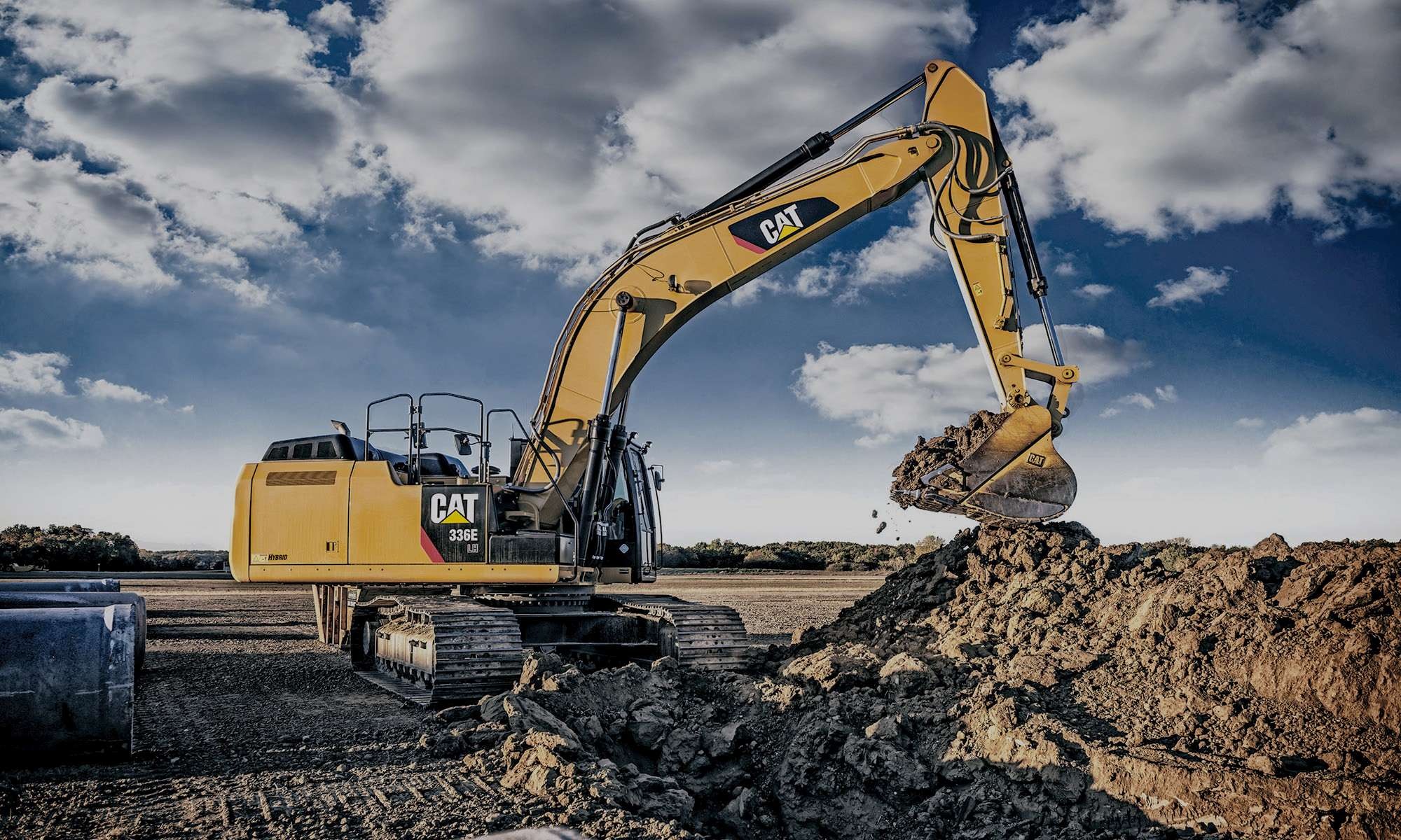 Yellow crawler excavator working at a construction site