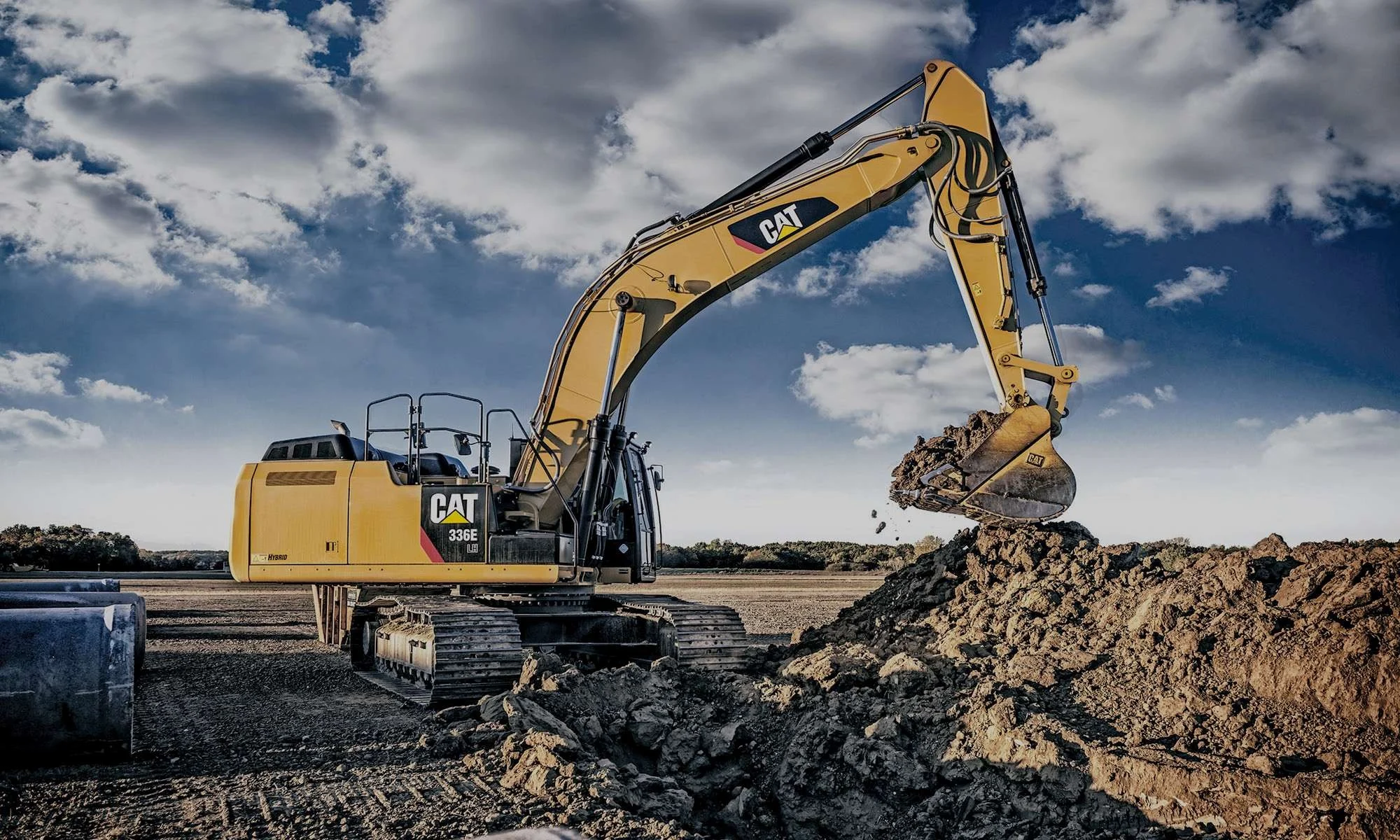 Yellow crawler excavator working at a construction site