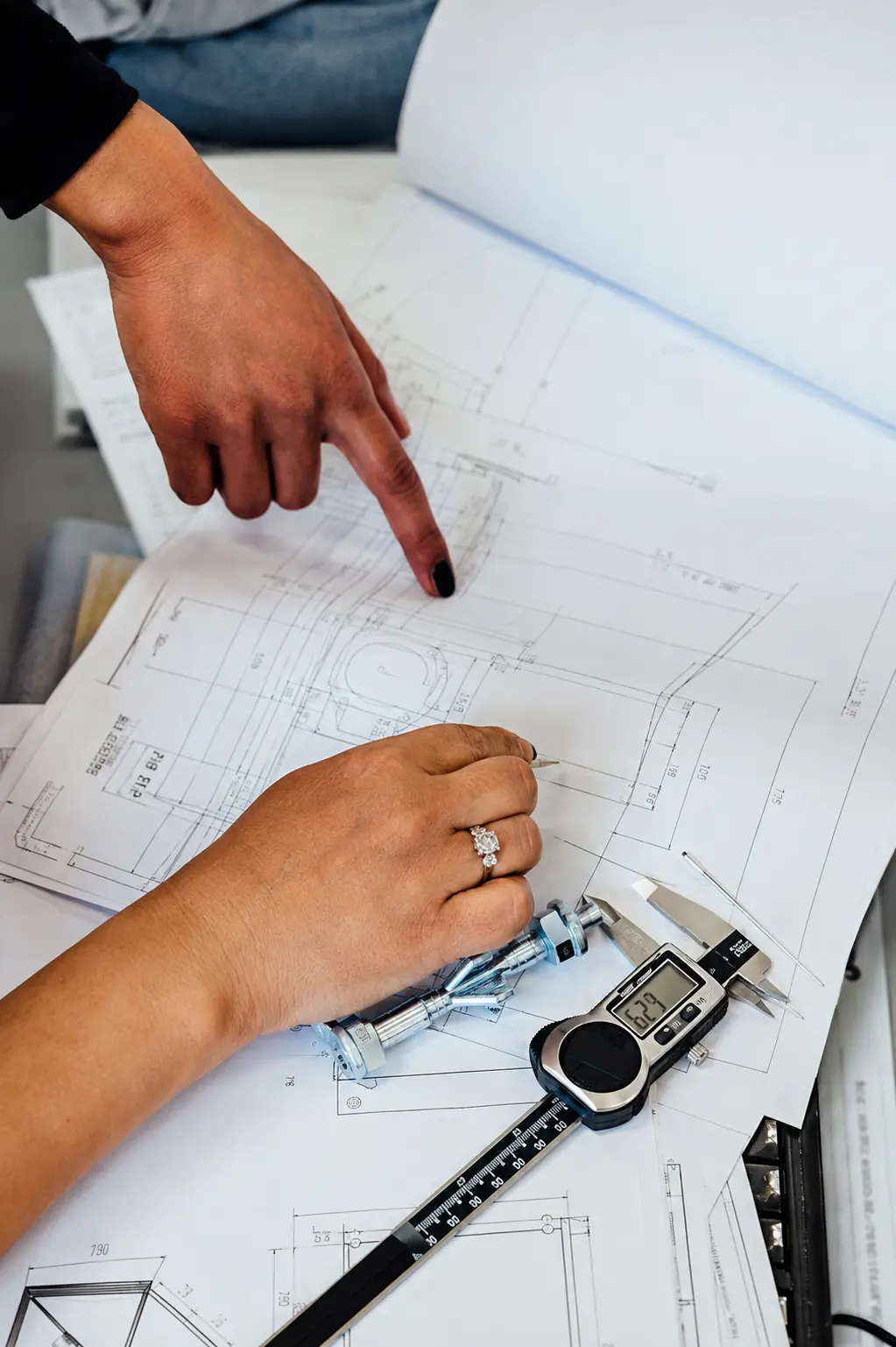 Excavator part identification using a technical drawing and precision measuring tool